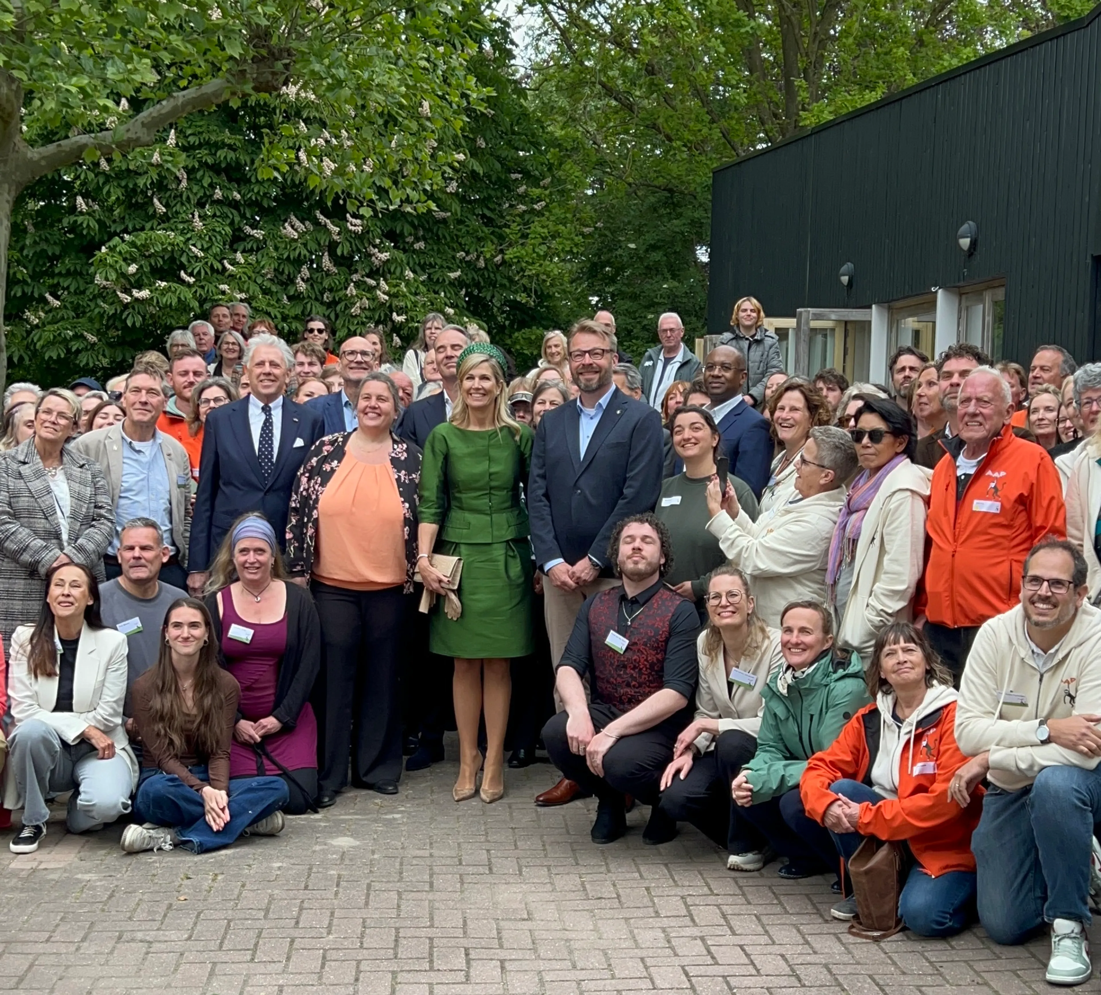 De groepsfoto met de koningin.