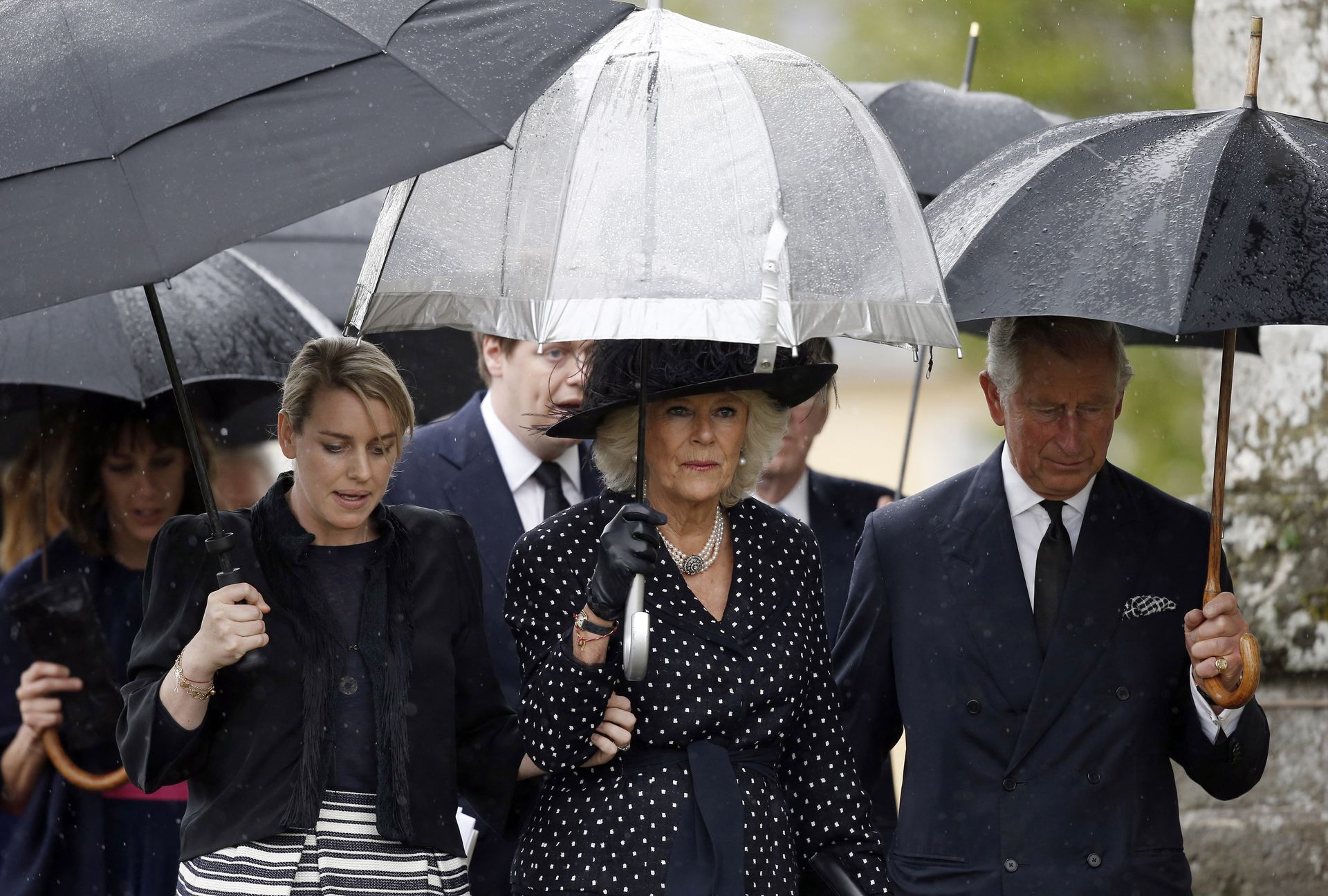 Charles, Camilla en Laura tijdens de begrafenis van Mark Shand, de broer van koningin Camilla, in 2014.