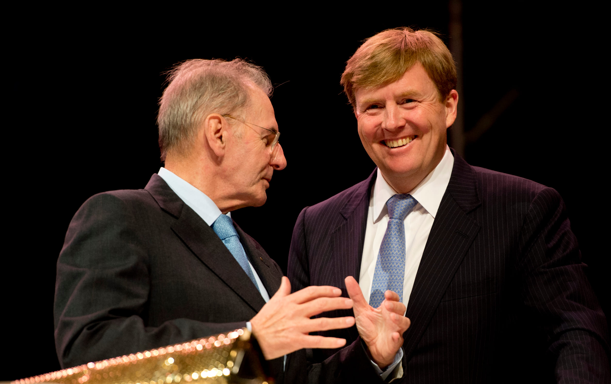 Prins Willem-Alexander en IOC-voorzitter Jacques Rogge tijdens de viering van het 100-jarig bestaan