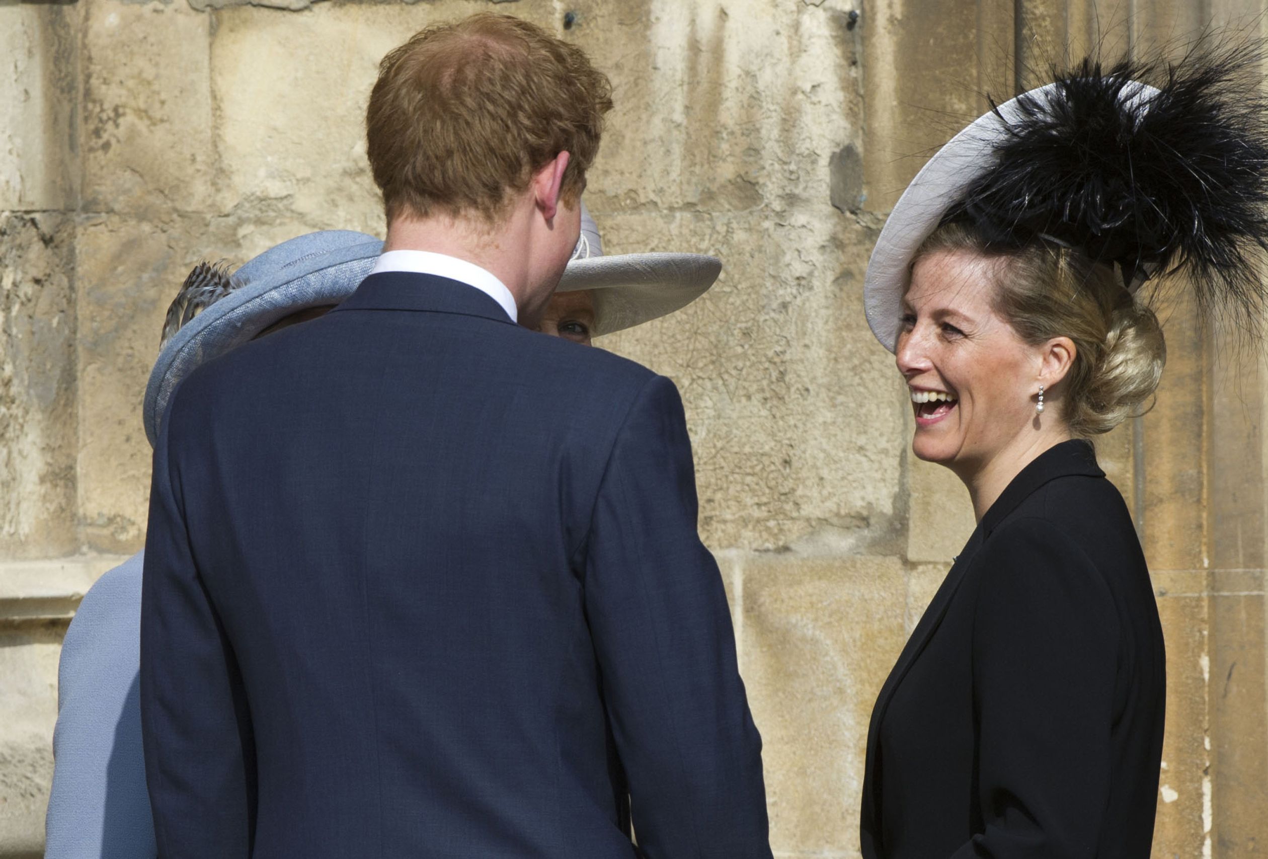In 2012, lachend met prins Harry.